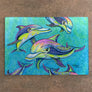Rainbow Dolphins Cutting Board